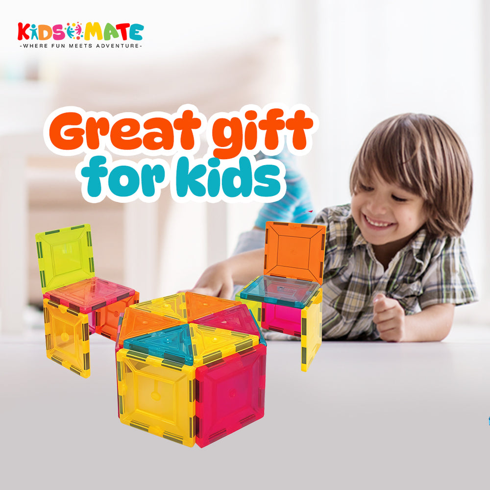 Colorful magnetic tiles in various shapes, including squares and triangles, arranged to form small structures. A smiling child interacts with the tiles, showcasing creativity and playfulness.
