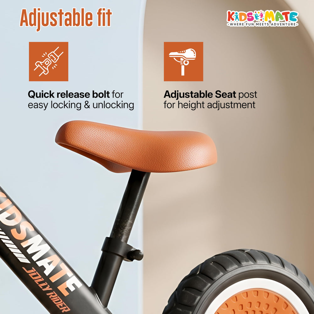 A close-up view of a balance bike featuring an adjustable seat post and quick locking mechanism. The bike has a sleek design with a brown seat and a prominent Kidsmate logo.