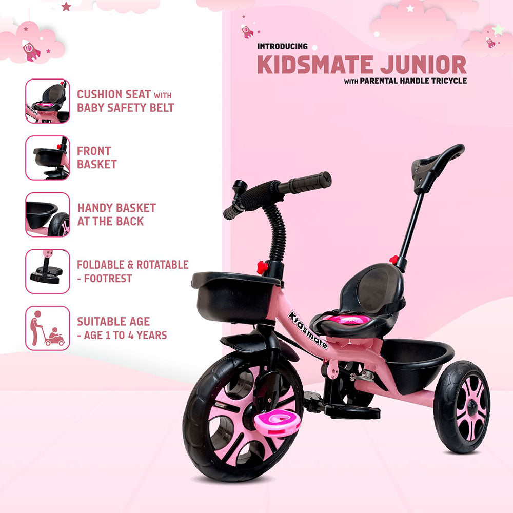A pink Kidsmate Junior tricycle featuring a cushioned seat with a baby safety belt, a front basket, and a parental control handle. Suitable for ages 1 to 4 years, it has a rotatable footrest.