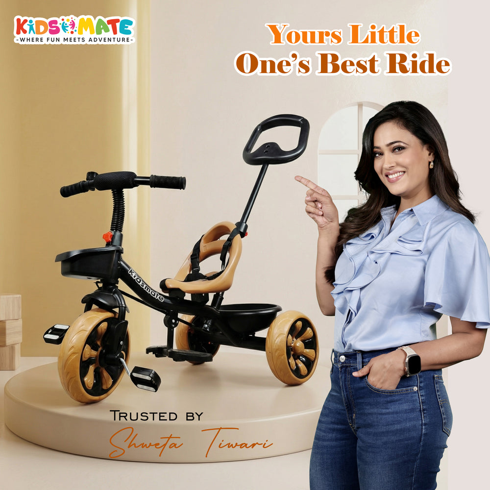 A stylish Kidsmate Junior Tricycle featuring a sleek black frame and wooden accents. The tricycle has a comfortable seat and a parental control handle. A smiling woman stands beside it, promoting the product.