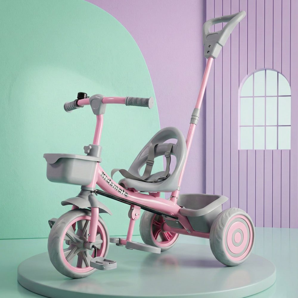 A pink and grey tricycle designed for kids, featuring a comfortable seat, handlebars, and a parental control push handle. The tricycle is displayed against a pastel background.