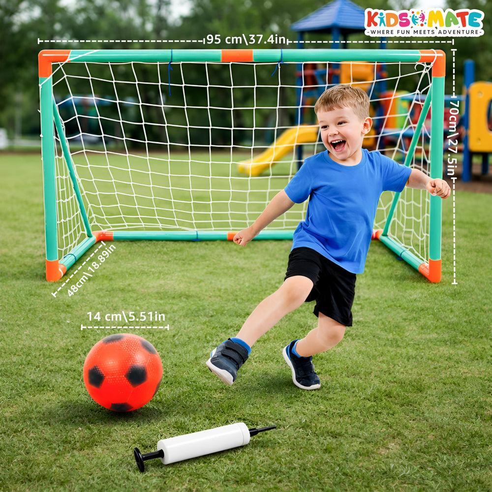 A cheerful child in a blue shirt and black shorts plays with a red and black soccer ball near a colorful kids football goal. A pump is placed beside the ball, with measurements displayed on the goal.