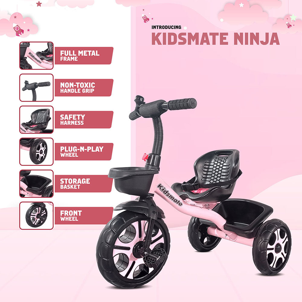 Durable pink tricycle designed for kids, featuring a full metal frame, non-toxic handle grip, safety harness, storage basket, and stylish front wheel. Kidsmate branding is visible.