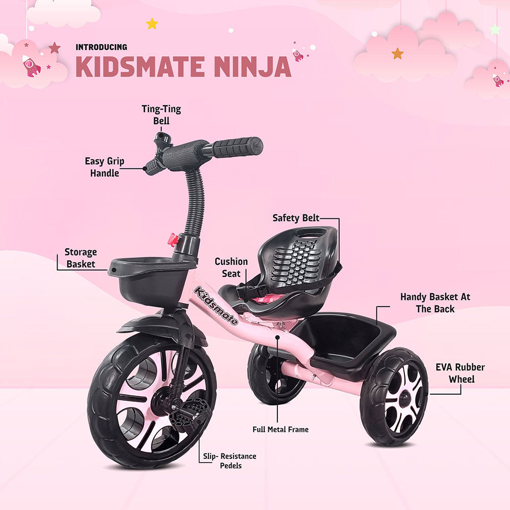 A colorful Kidsmate Ninja tricycle featuring a cushioned seat, safety belt, storage basket, and a Ting-Ting bell. The tricycle has a sturdy full metal frame and slip-resistant pedals, set against a playful pink