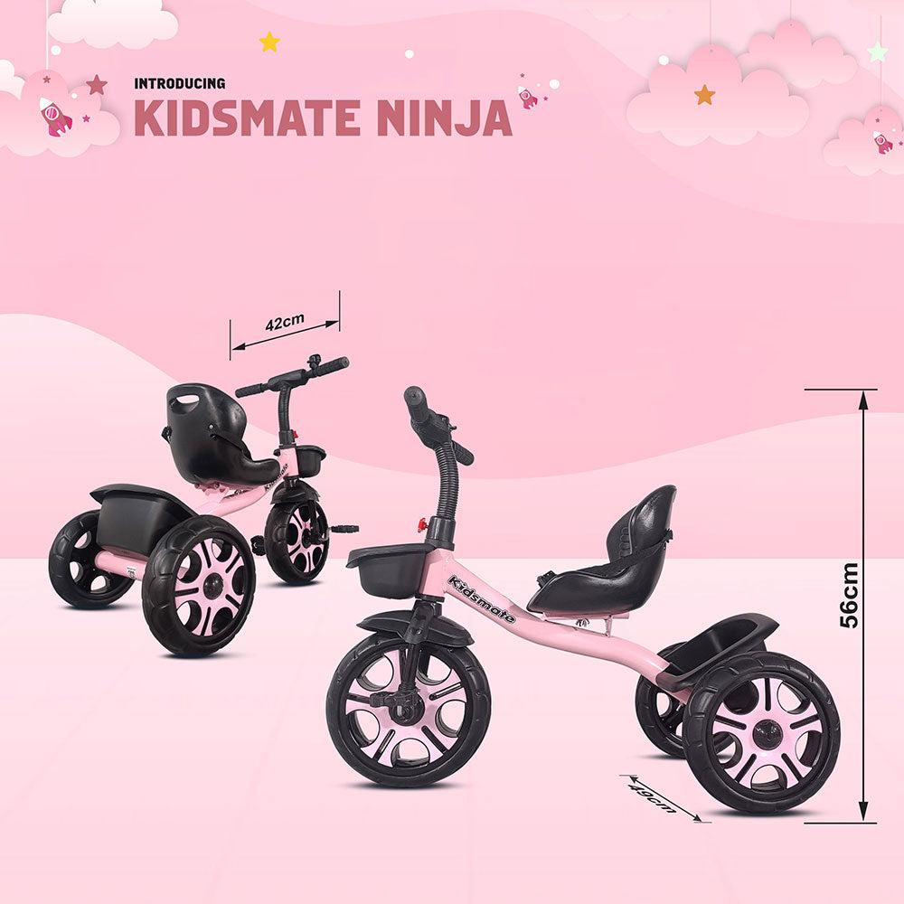 A vibrant pink tricycle designed for kids, featuring a comfortable seat and sturdy wheels. The backdrop includes playful clouds and a cheerful design, highlighting the Kidsmate brand.