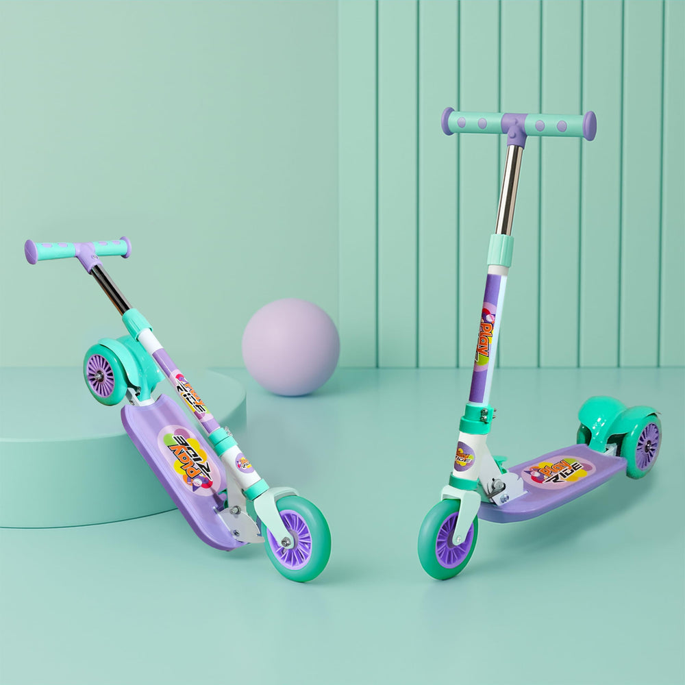 A vibrant purple and teal 3-wheel kick scooter designed for kids, featuring a sturdy metal frame, colorful graphics on the footboard, and large wheels for smooth riding. A playful purple ball is in the background.