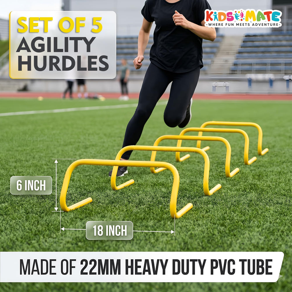 A set of five agility hurdles arranged on a grassy field, featuring bright yellow frames. A child is demonstrating agility training by jumping over the hurdles.