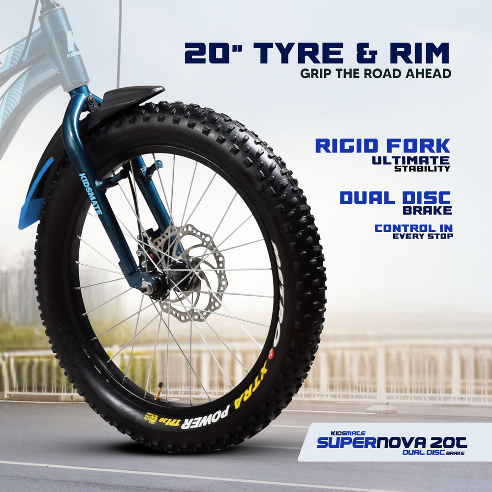 Close-up of a 20-inch semi fat tire showcasing a rugged tread pattern, designed for stability and grip. Features a rigid fork and dual disc brake for enhanced control, set against a blurred outdoor background.