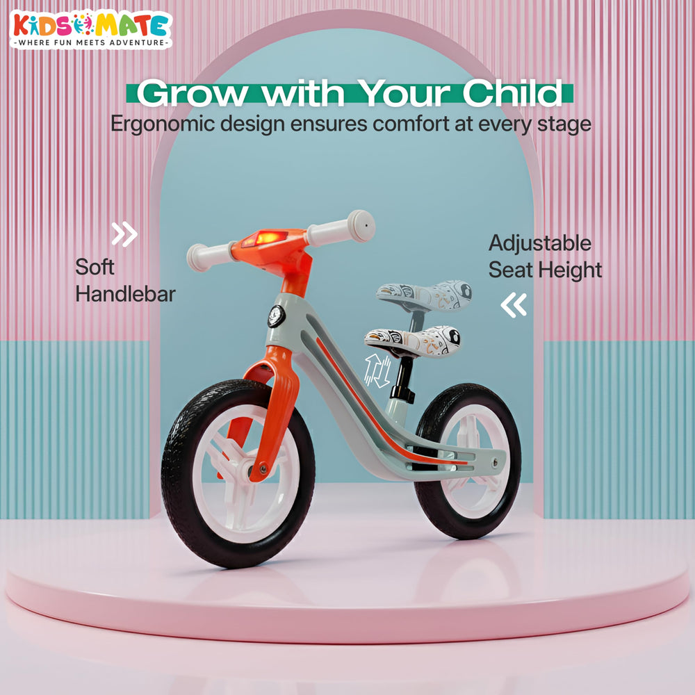 A colorful balance bike designed for kids, featuring a soft handlebar and adjustable seat height. The bike has a sleek frame with a mix of orange and gray colors, set against a playful backdrop.
